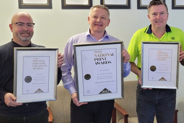 Percival Print & Packaging account manager Allan Hollis, managing director Colin Lamond and production manager Paul Lamb collecting PICA awards