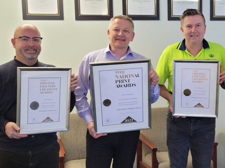 Percival Print & Packaging account manager Allan Hollis, managing director Colin Lamond and production manager Paul Lamb collecting PICA awards